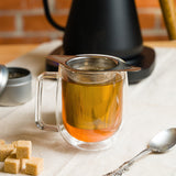 Tea steeping in a glass mug using the Mesh Tea Infuser Basket